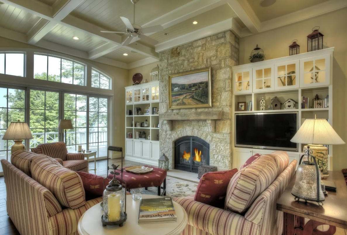 A cozy living room filled with furniture and a fireplace.