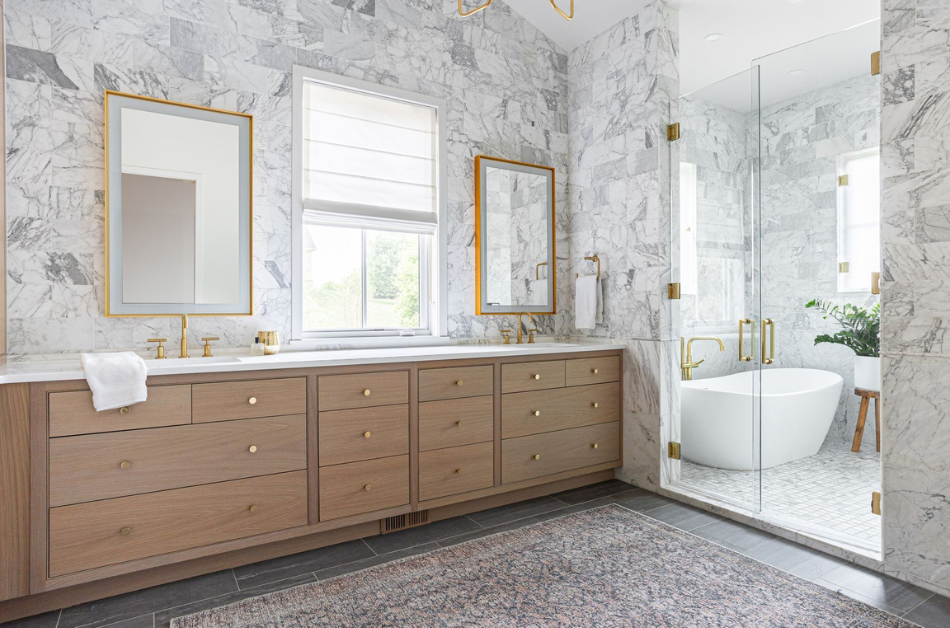 A bathroom with two sinks, two mirrors, and a bathtub.