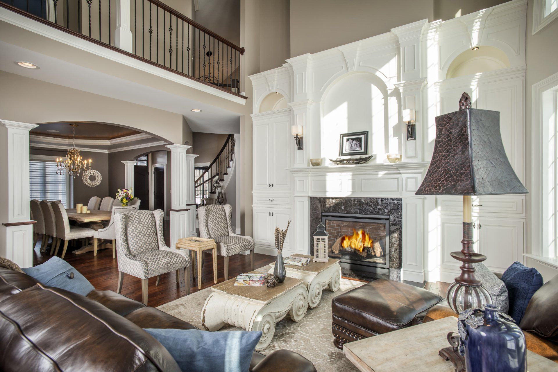 A living room filled with furniture and a fireplace.