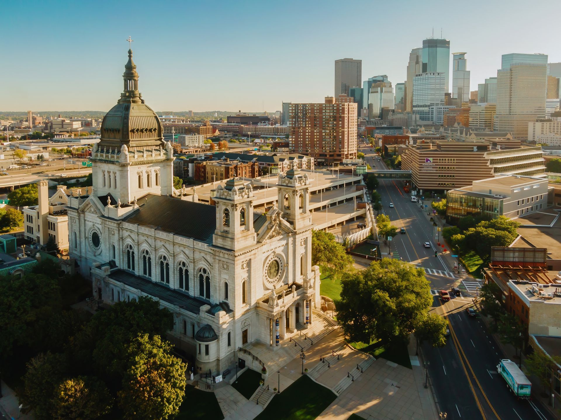 An aerial view of a large building in the middle of a city.