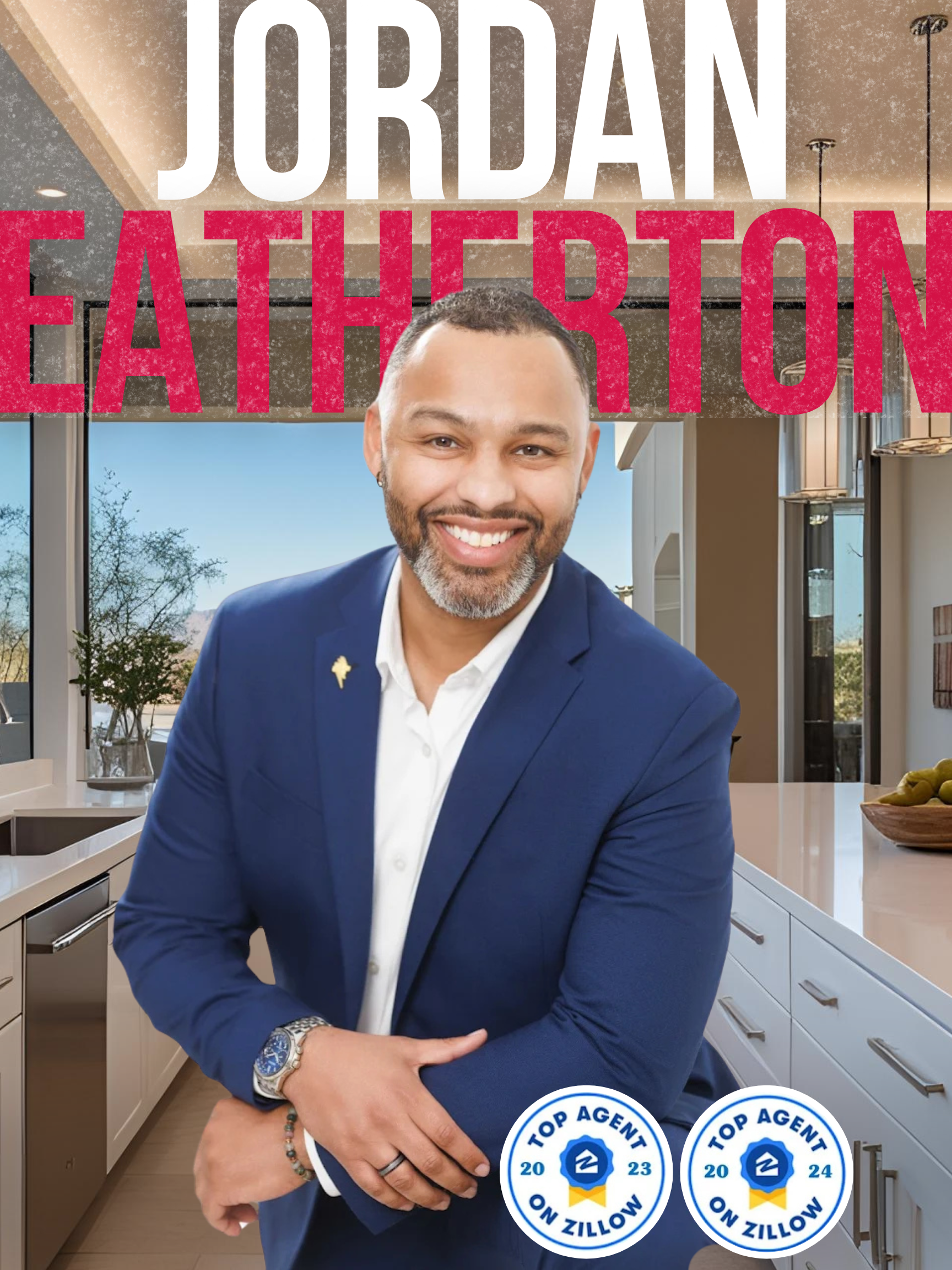 A man in a blue suit is standing in front of a kitchen.
