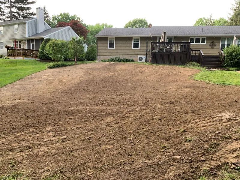 A house with a lot of dirt in front of it