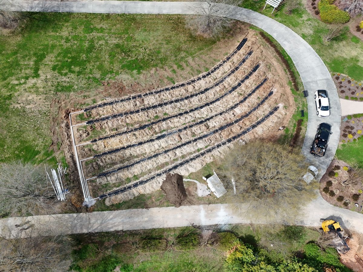 An aerial view of a stone amphitheater in a park.