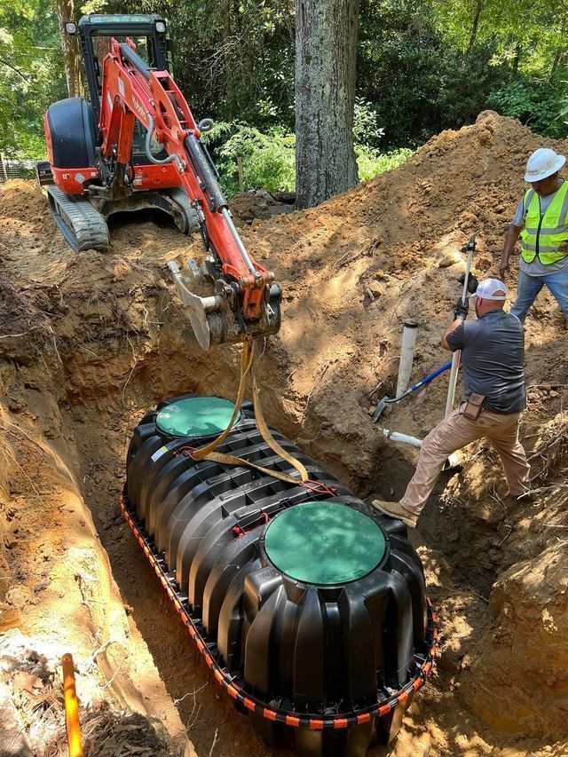 A man is digging a hole to install a septic tank.