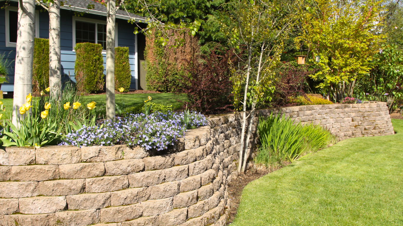 Brick house with a winding stone path leading through a green lawn.