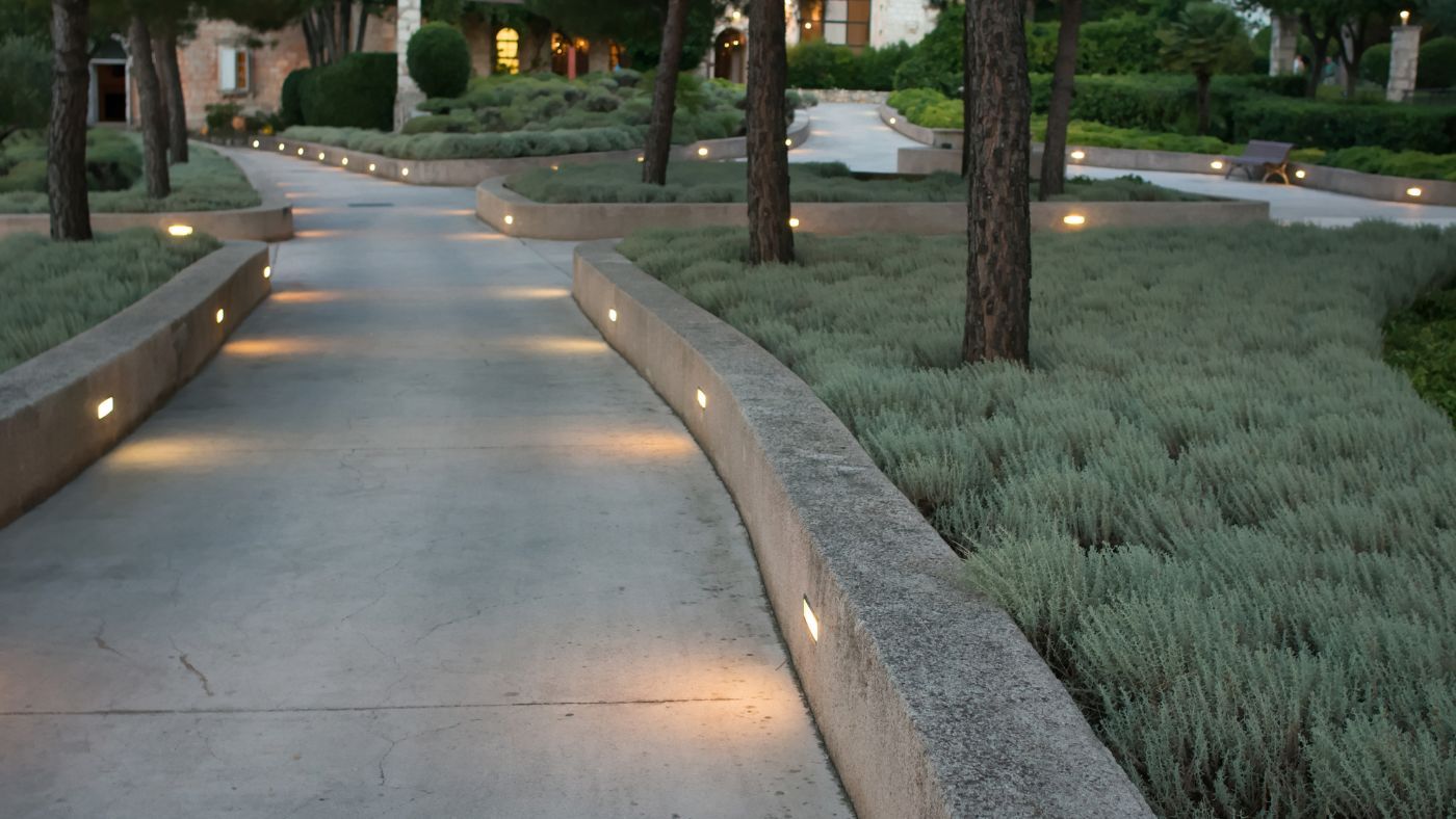 Landscape lighting highlighting outdoor patio and walkway