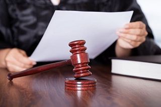 Female judge reading verdict - Divorce Attorney Services in Worcester, MA