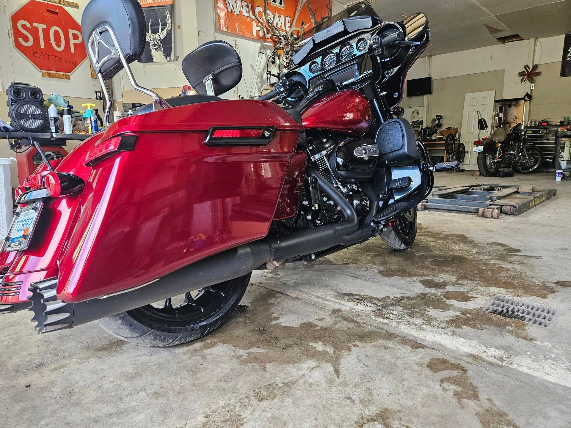 Red motorcycle parked in a garage.