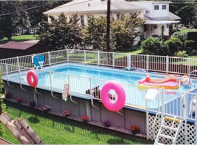 A large swimming pool with a pink life preserver attached to it