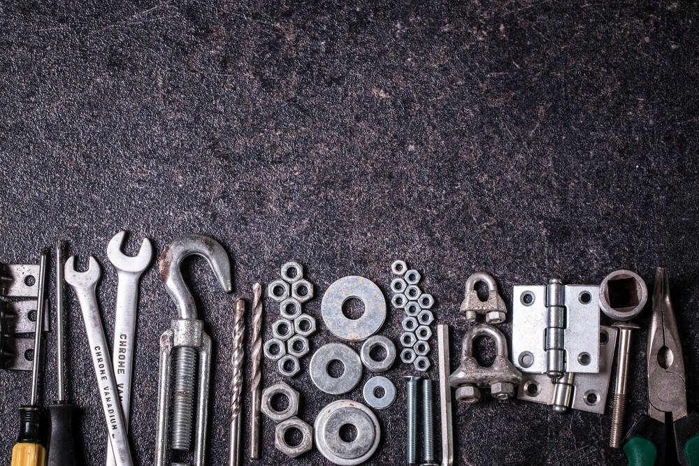 A Bunch Of Tools And Nuts Are Sitting On A Table — JA Toft & Co In Bundaberg Central, QLD