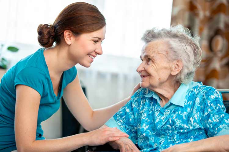Nurse caring for an elderly woman