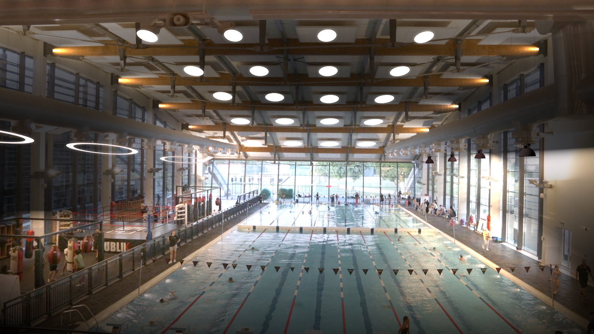 Hallenbad, Schwimmer in Bahnen, Glasfenster, Holzdecke, helle Lichter.