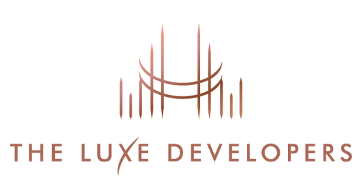 Logo von „The Luxe Developers“ mit einem abstrakten Gebäudedesign in Bronzefarbe.