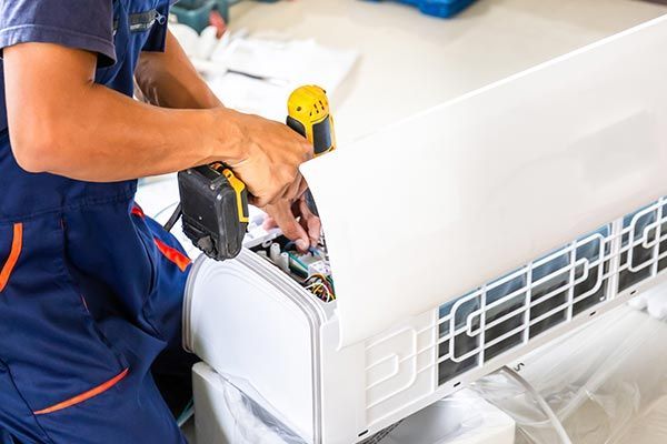 Technician Install New Air Conditioner — Island Heights, NJ — Air We Are Heating, Cooling, & Refrigeration