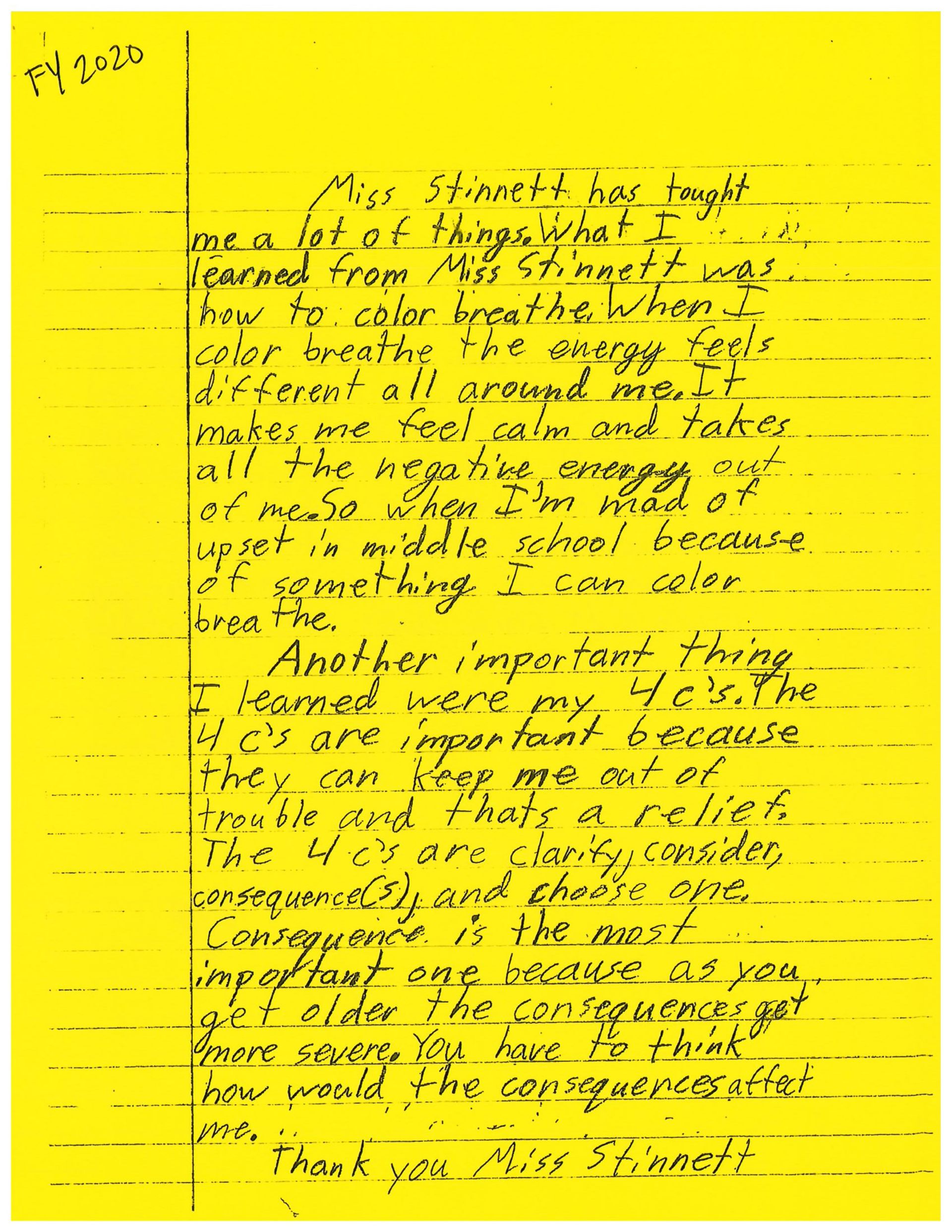 A yellow piece of paper with black writing on it