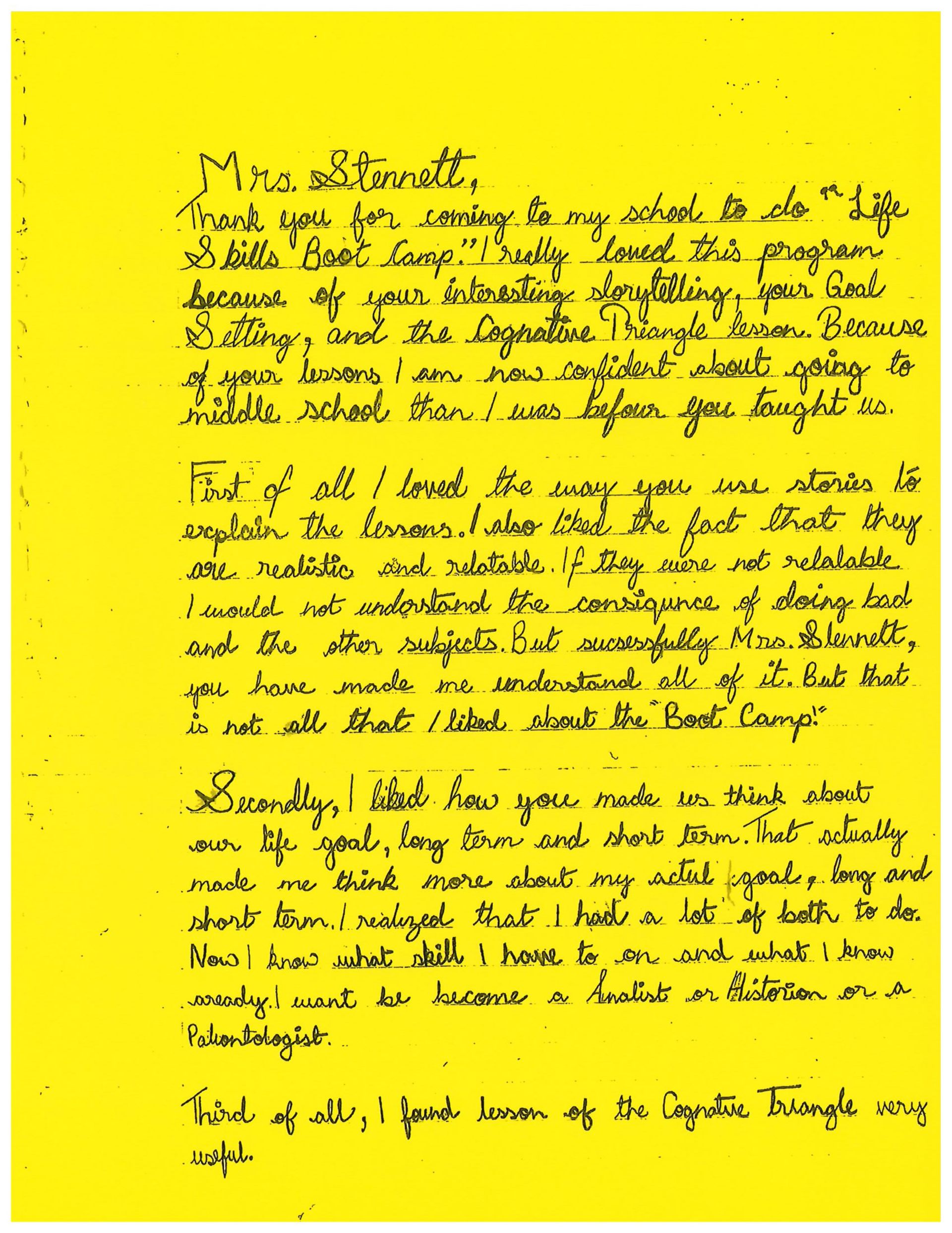 A yellow piece of paper with handwriting on it