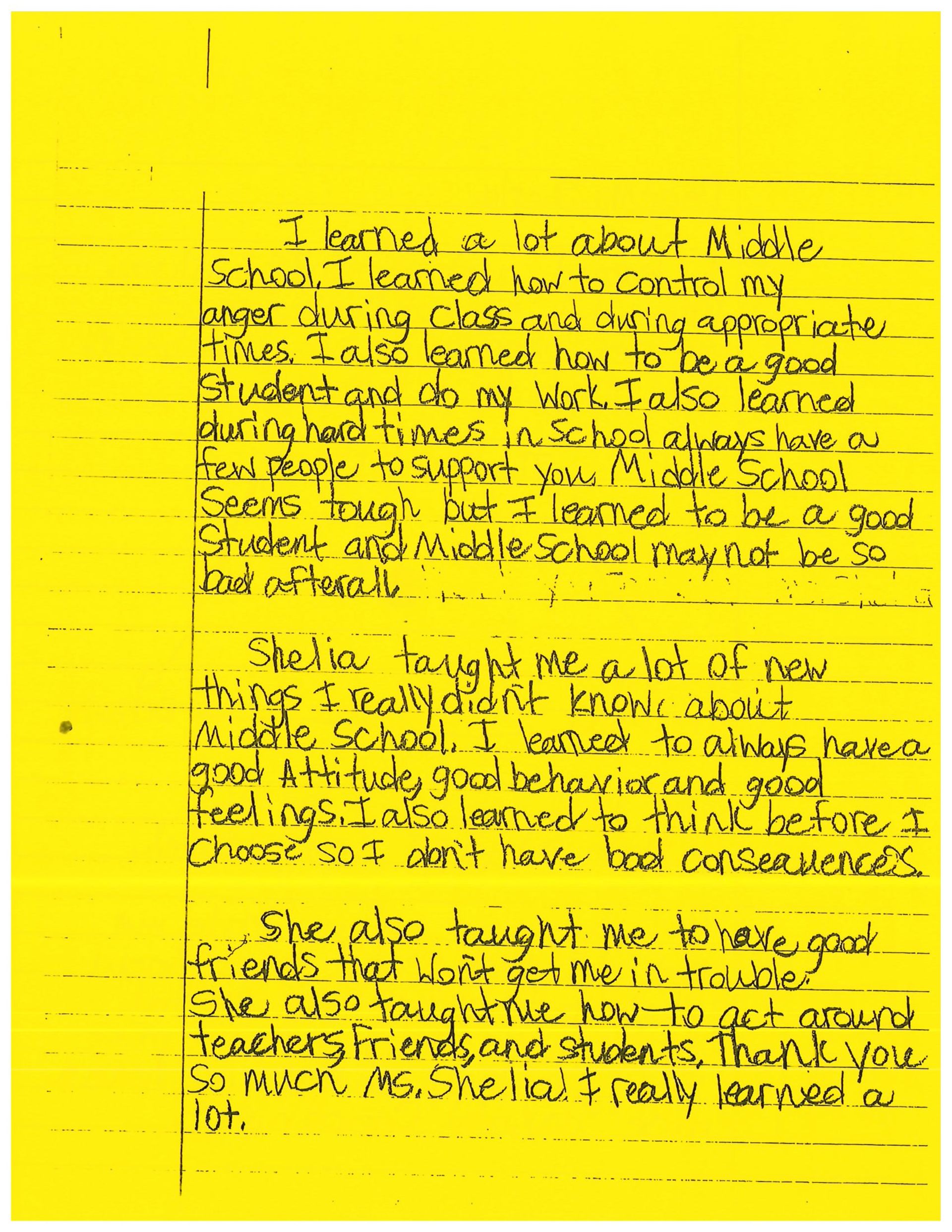 A yellow piece of paper with black writing on it