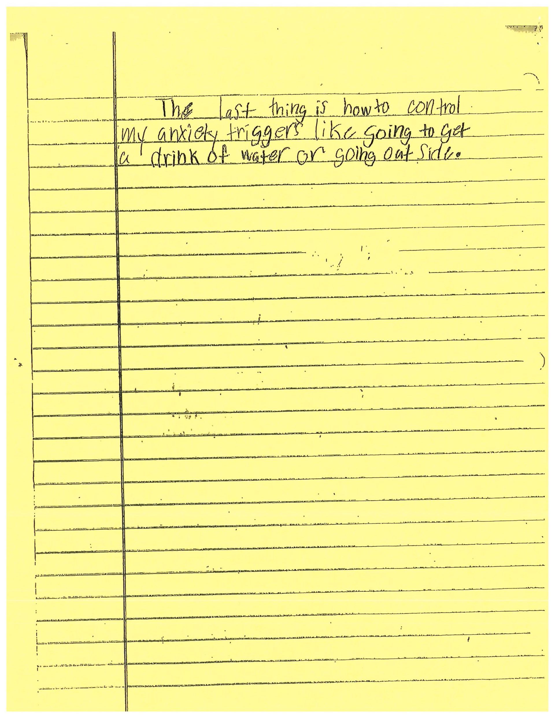 A piece of yellow paper with black writing on it