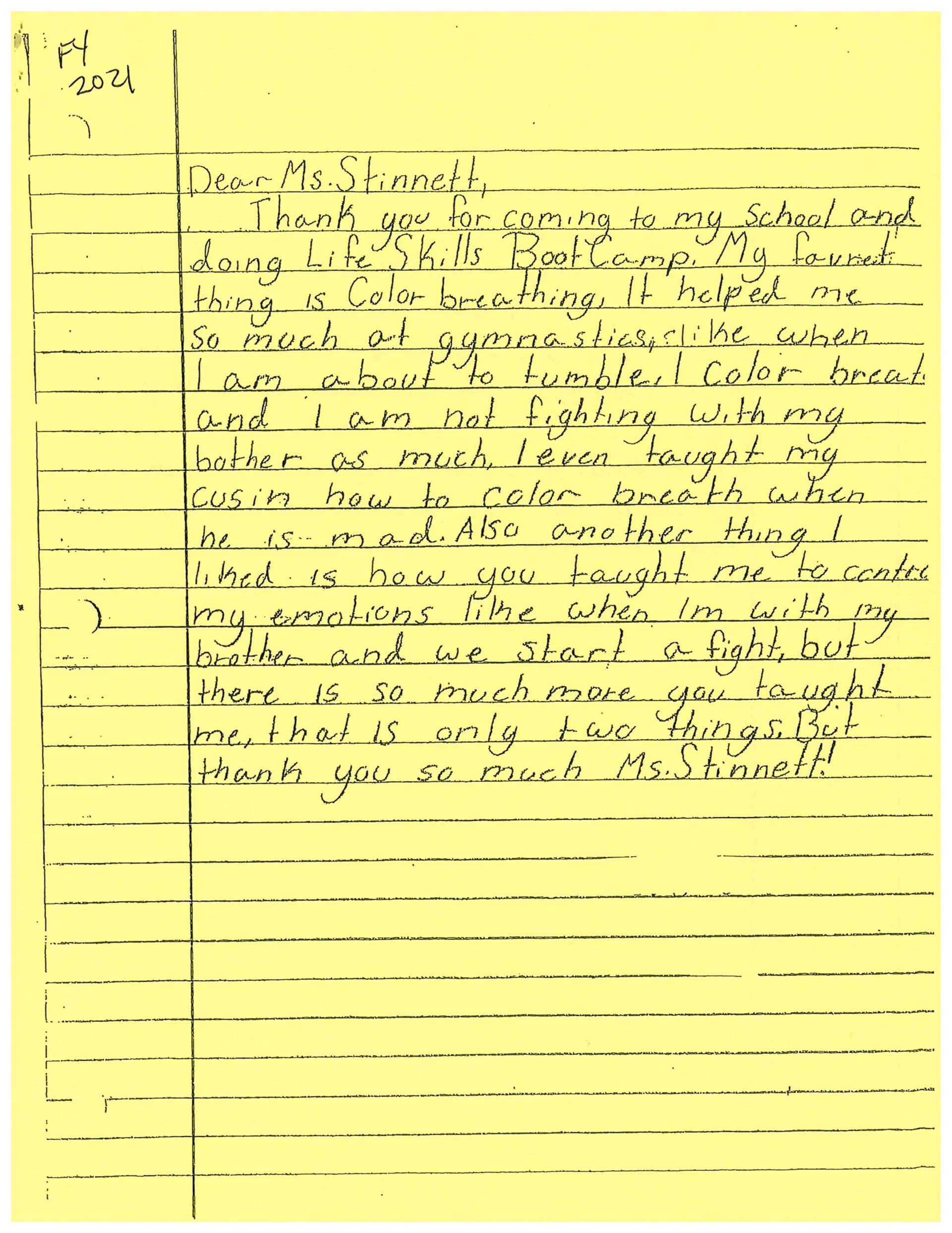 A yellow piece of paper with arabic writing on it