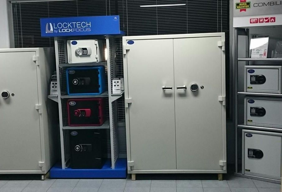 A Digital Safe Is Sitting on Top of A Wooden Shelf — Century Locksmiths In Toowoomba City, QLD