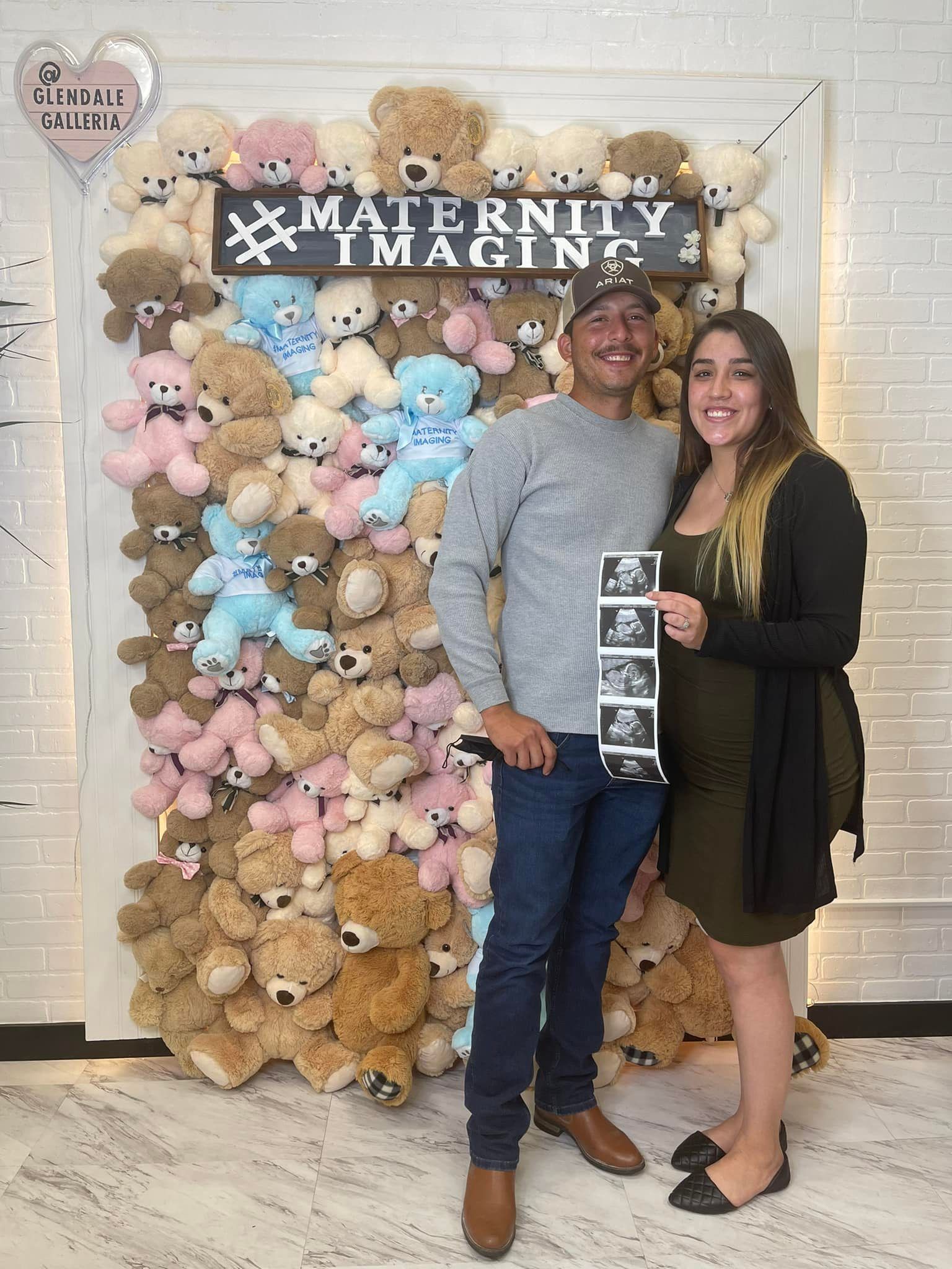 Happy Couple Showing Ultrasound Results — Glendale, CA — Maternity Imaging