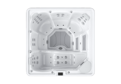 Overhead view of a white square hot tub with multiple molded seating areas and jet configurations.