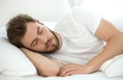 young bearded man sleeping