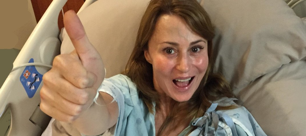 Young caucasian woman is happy during her carpal tunnel surgery recovery.