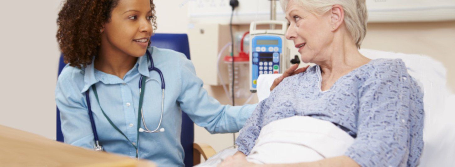 nurse comforts a post-surgical patient