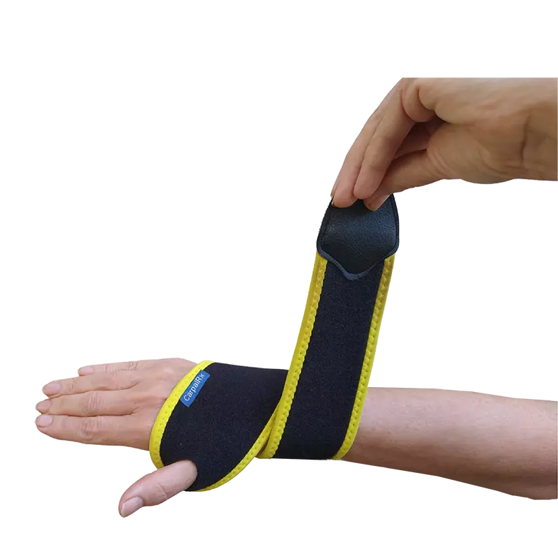 A person is wearing a black and yellow wrist brace