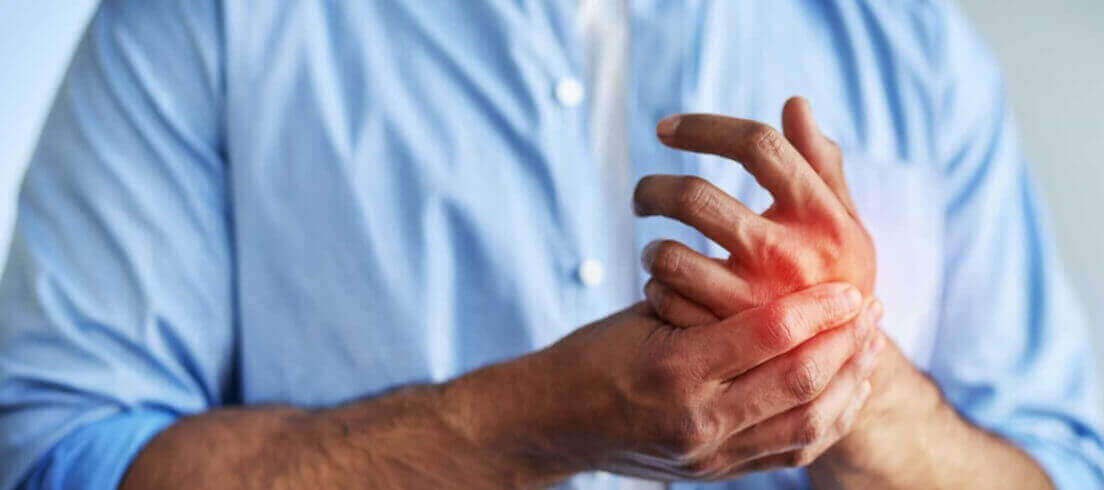 man with hand pain