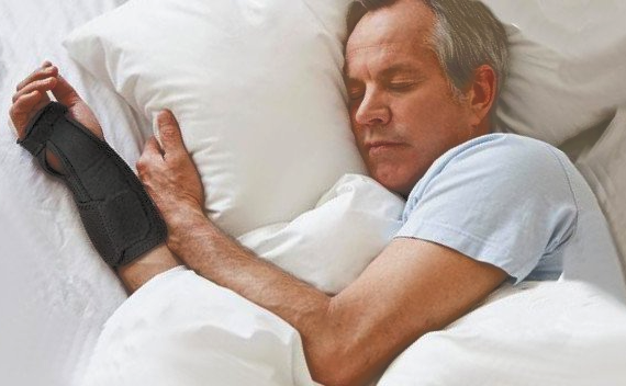 man sleeping with a brace