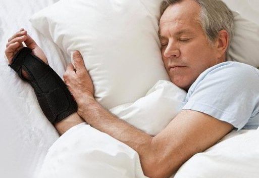 man sleeping with a night brace