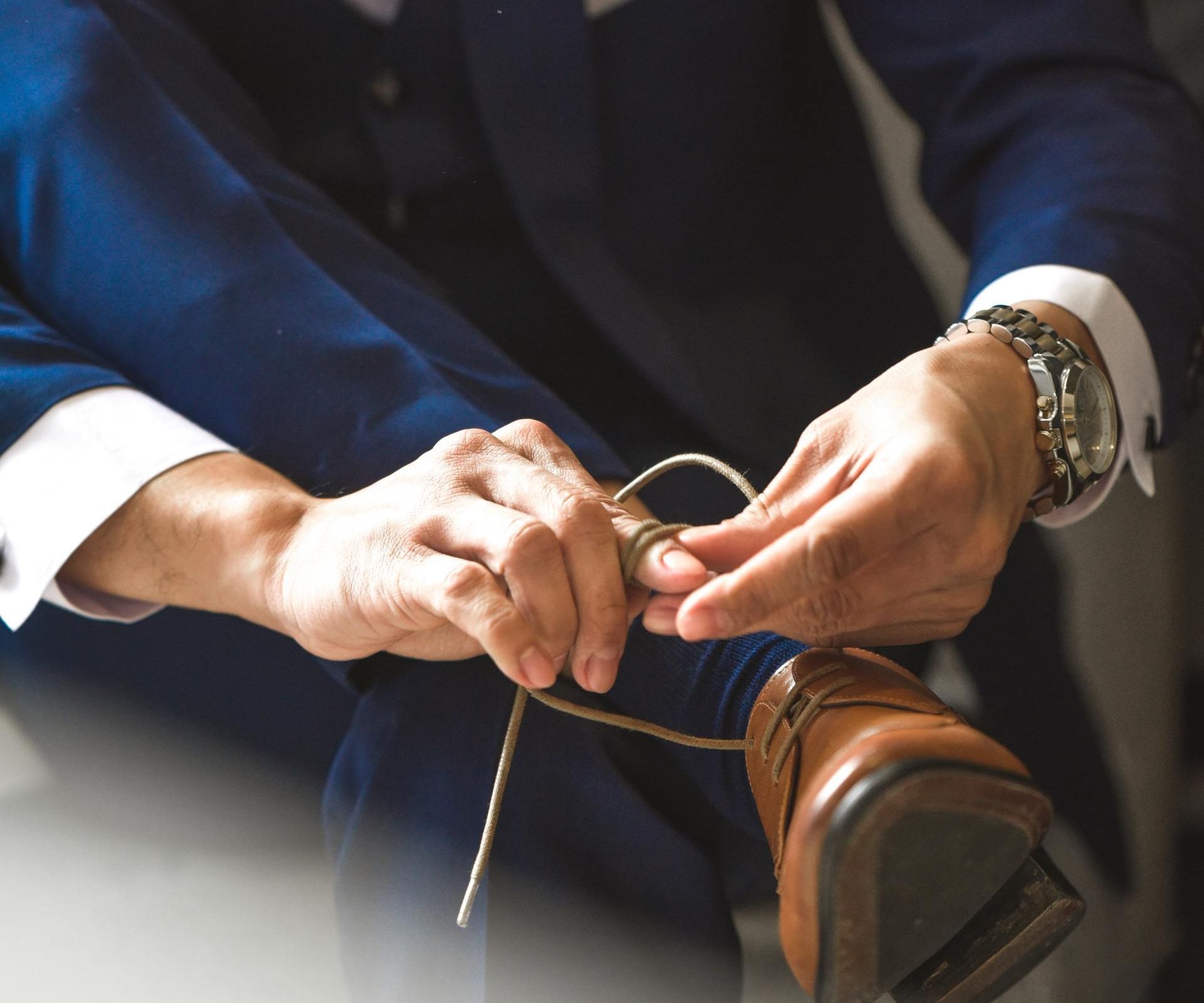 man tying a shoelace
