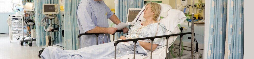 woman gets a post surgical evaluation