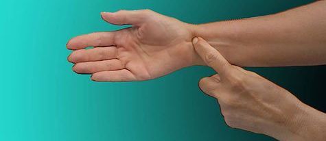 finger tapping the wrist