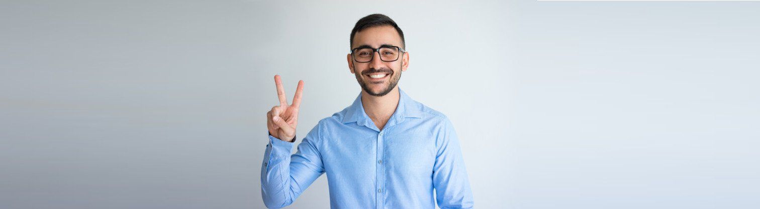 man making the victory sign