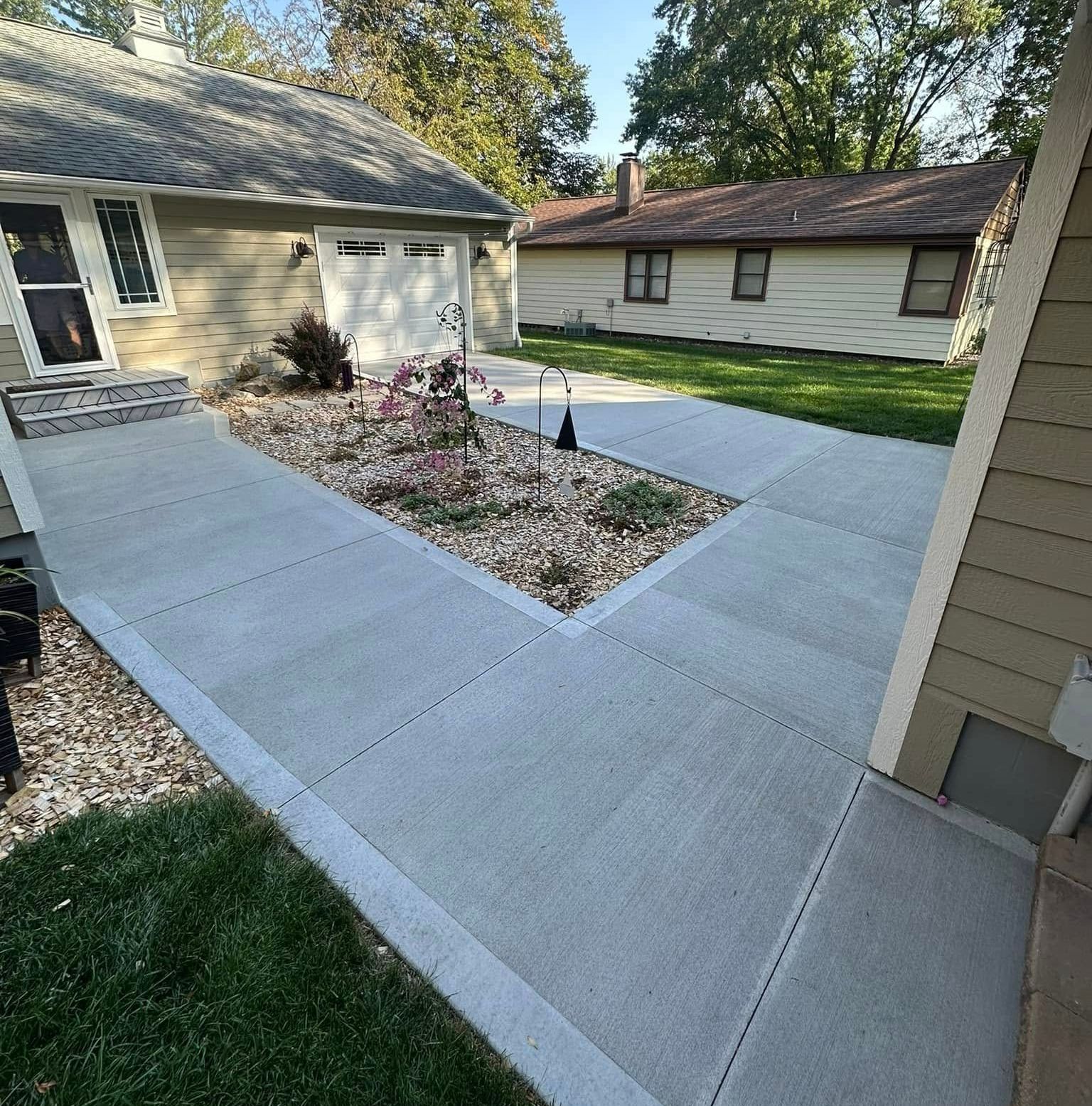 A house with a concrete walkway leading to it