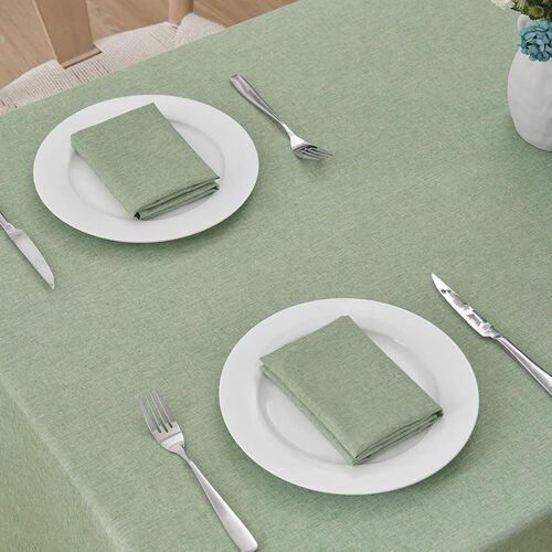 A white table cloth is on a folding table.