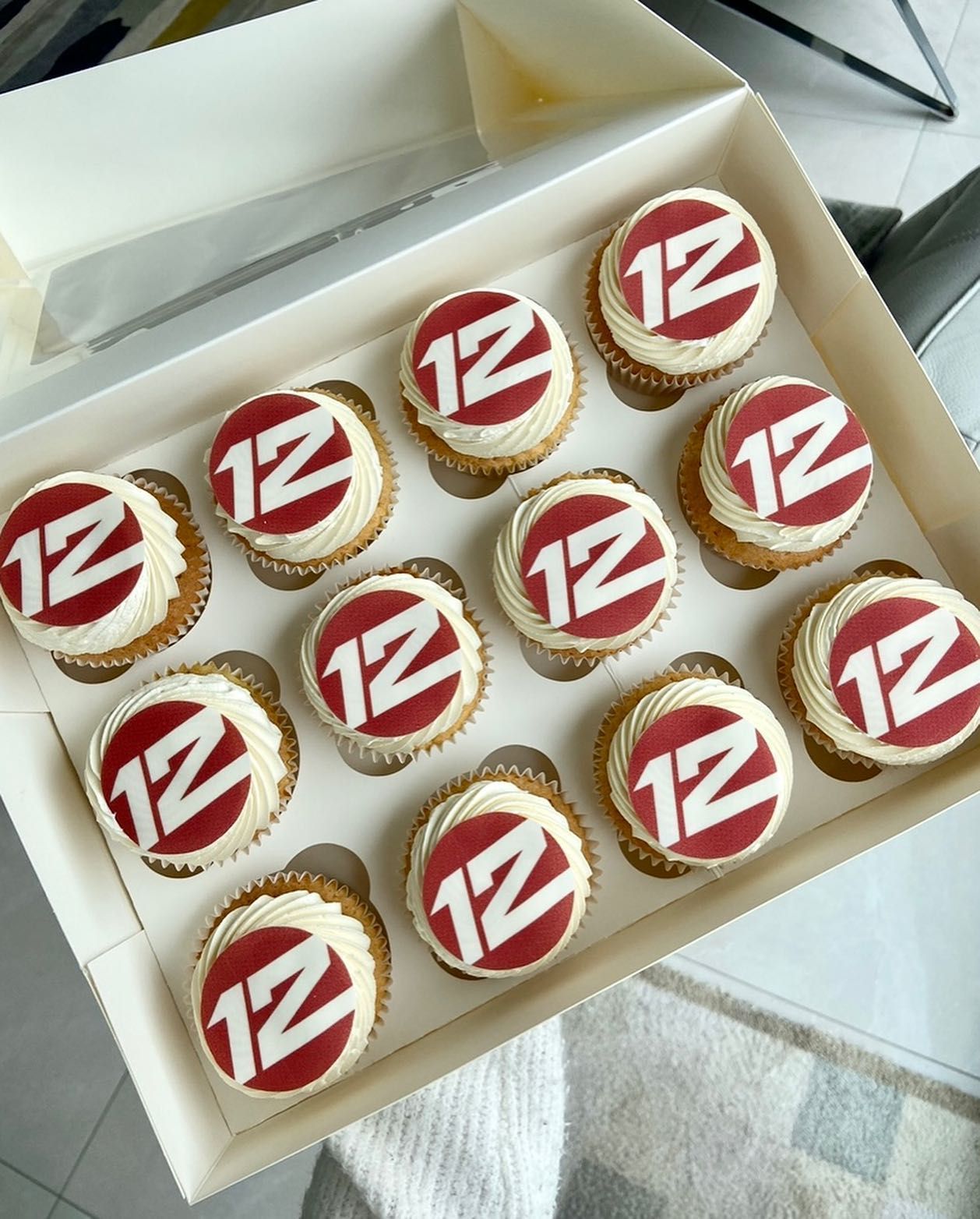 A box of cupcakes with the number 12 on them