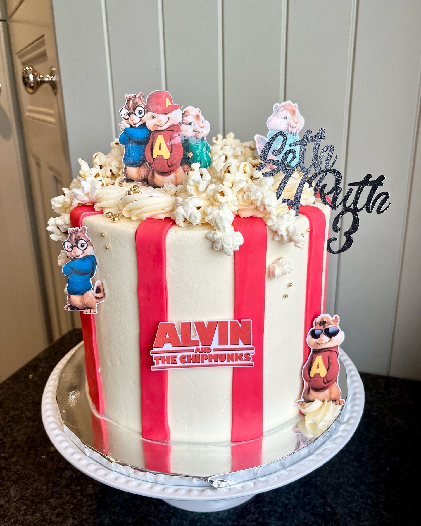 A cake with alvin the chipmunk on top of it.