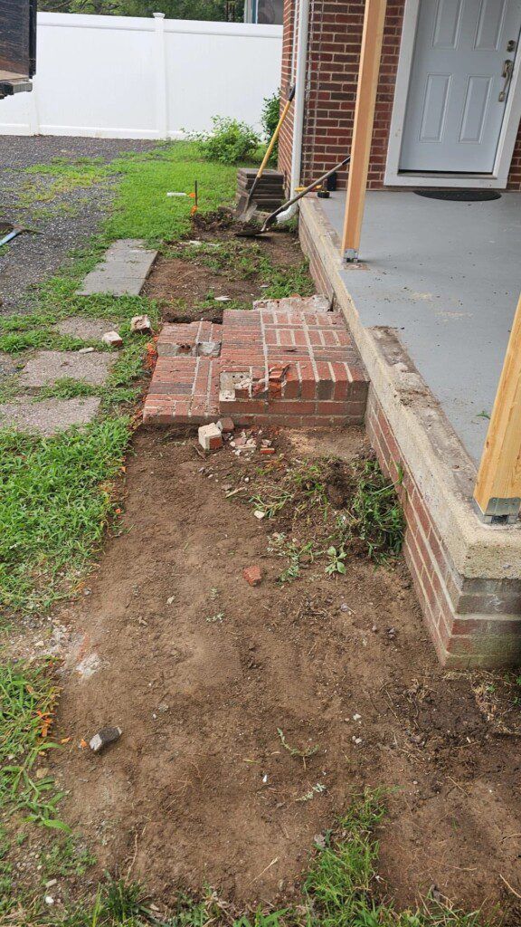 before new steps are put in and grass planted