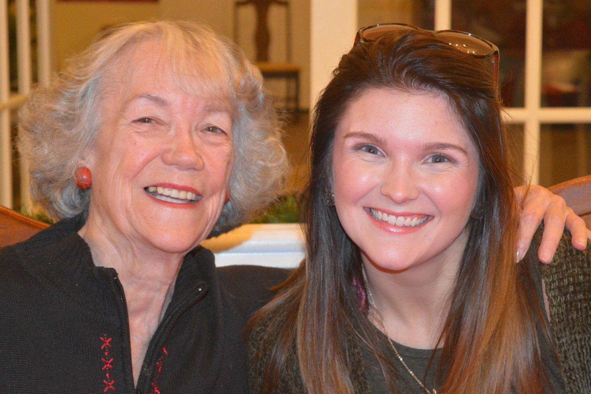 Resident poses with relative at Innisfree Senior Living