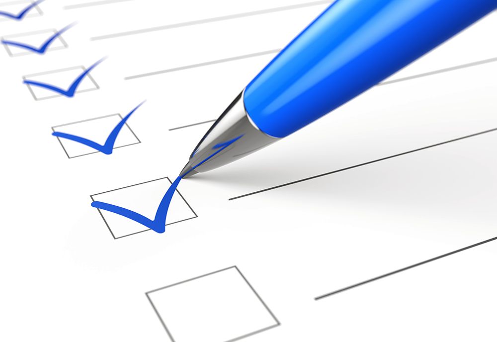 Blue pen making checks on a list