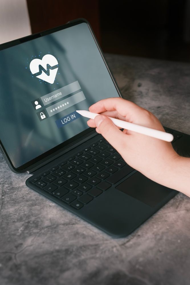 Person using tablet pen to log into a telehealth appointment