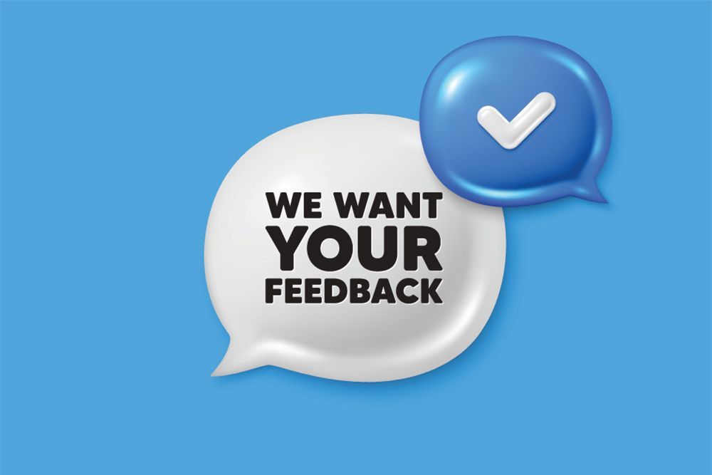 Speech bubbles on blue background reading “We want your feedback” with a checkmark icon