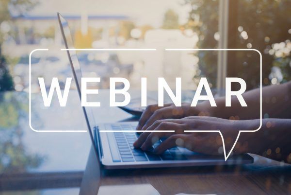 Webinar pop-up text in front of person on laptop