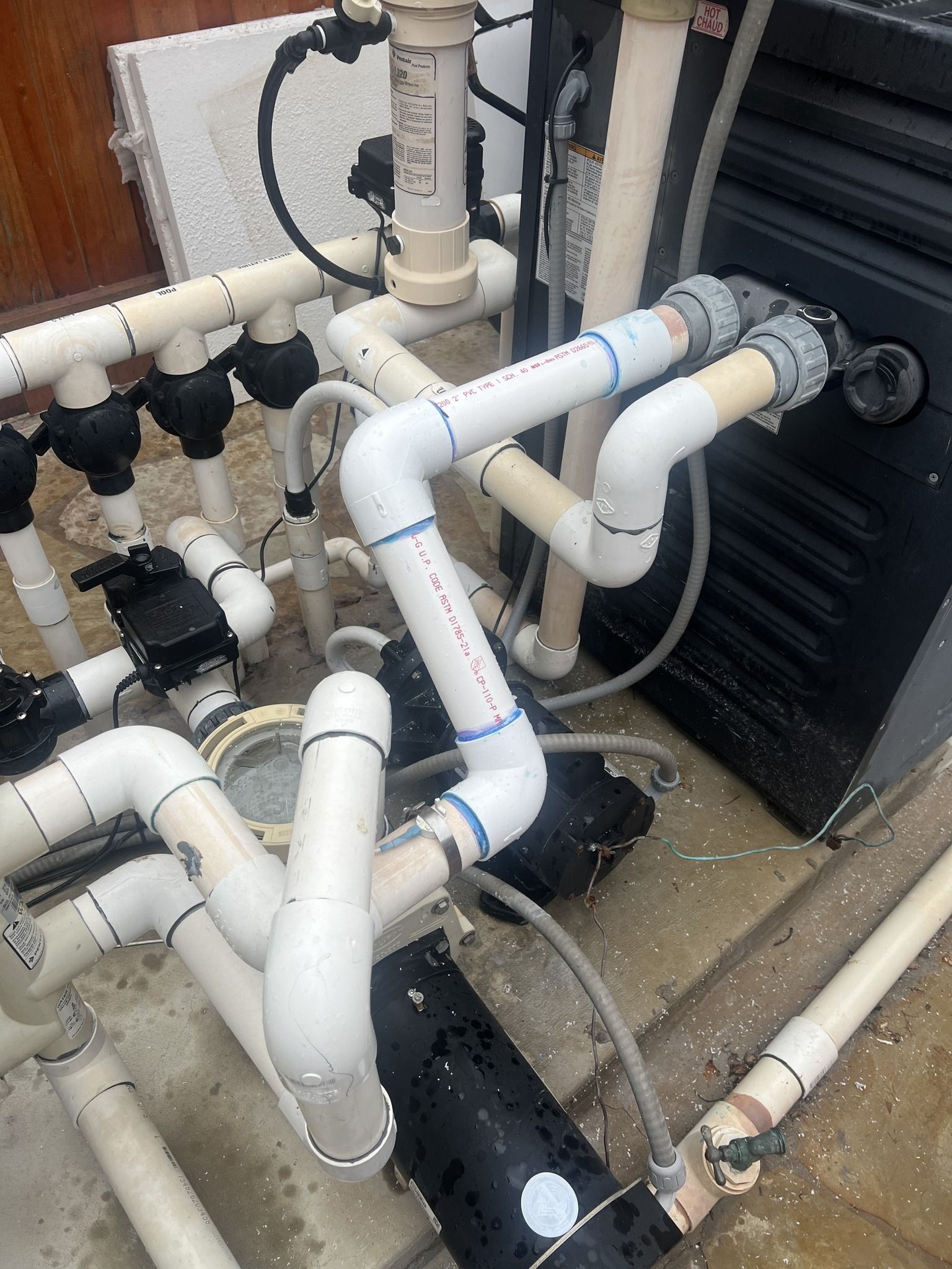 A bunch of pipes are connected to a machine.