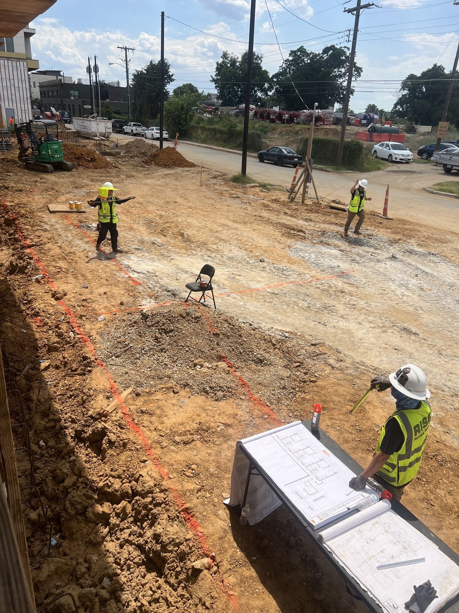 A group of construction workers are working on a construction site.