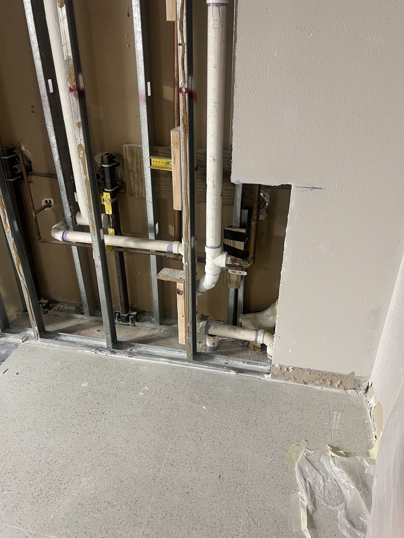 A room with a lot of pipes coming out of the wall.